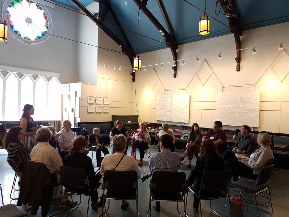 Members discussing in a circle at Spring Retreat