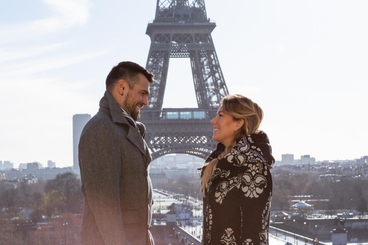 Photo of Chelsey and Jaaji in front of the Eiffel Tower