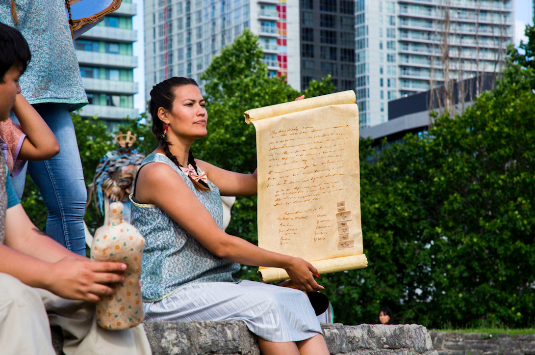 Actor holds treaty prop during Talking Treaties