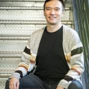 Photograph of Michael Caldwell smiling into the camera. Photo by Ömer Yükseker