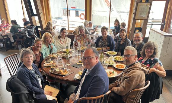 OP Members have dinner while visiting Pacific Contact