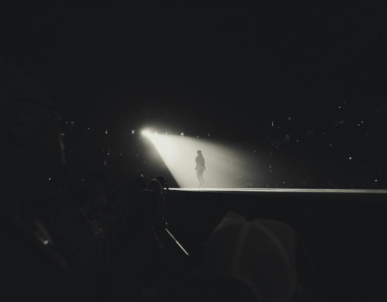 A performer in a spotlight