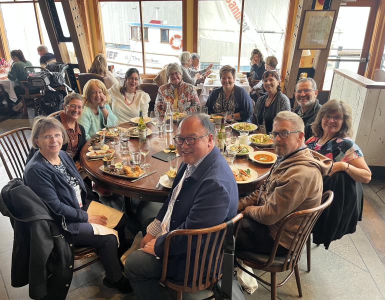 OP Members have dinner while visiting Pacific Contact